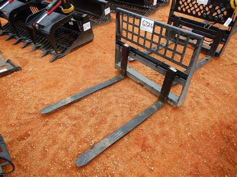 skid steer with forks white background with forks and tracks|aftermarket skid steer forks.